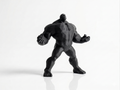 Black superhero figurine on a white background