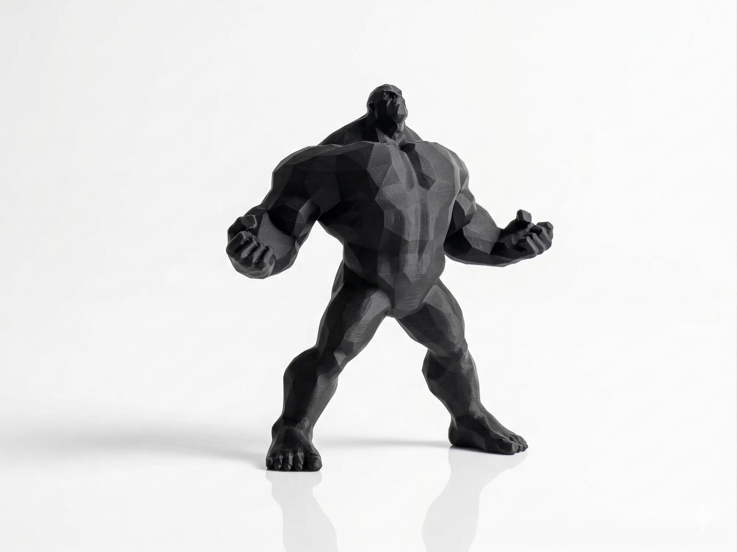 Black superhero figurine on a white background